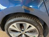 a close up of a tire on a car with a sticker on it