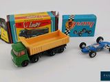 a toy truck and a toy car next to each other