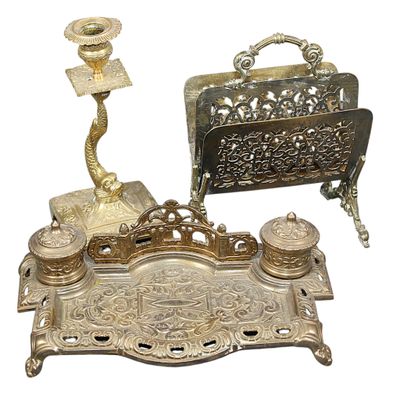 a silver tray with a candle and a pen and inkwell on it