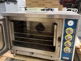 a toaster oven sitting on a pallet in a warehouse