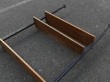 a bed frame that has been knocked over on the ground