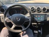 the interior of a car with a steering wheel, dashboard, and dash board