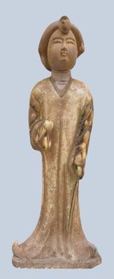a statue of a man with a hat holding a banana