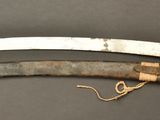 an image of a pair of old knives sitting on top of a table