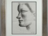 an image of a drawing of a woman ' s face in a wooden frame
