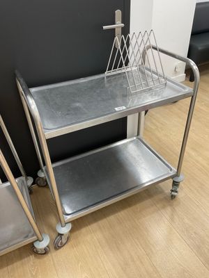 stainless steel utility cart with two baskets on top of it