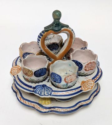 a blue and white plate with a heart shaped bowl on it