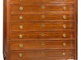 an image of a wooden chest of drawers with marble top