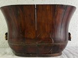 a wooden bucket that is sitting on a table