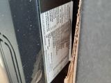 a piece of cardboard on the side of a car door