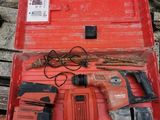 a red tool box with tools in it on the ground