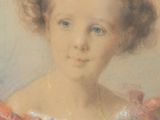portrait of a young girl in a red dress with a red bow