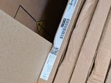 a stack of boxes sitting on the floor next to each other