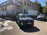 a black car parked in front of a building