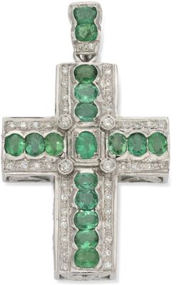 an emerald and diamond cross pendant