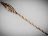 an old wooden stick with a decorative design on it