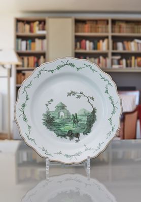 a plate that has a picture on it on a table
