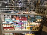a cart with a lot of books on it in a warehouse