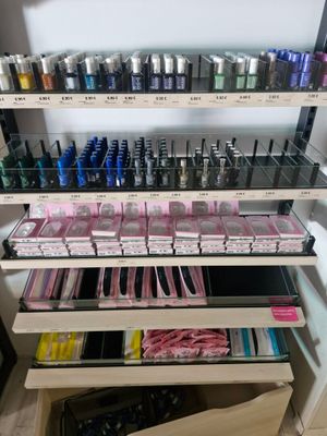 many bottles of nail polish on the shelves in the store