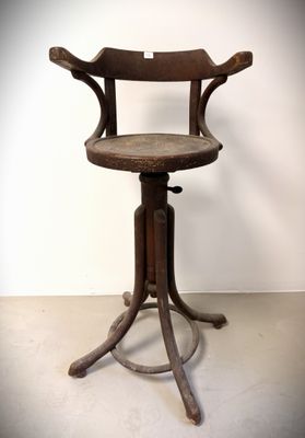 an old wooden chair with a wooden seat on a metal stand