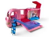 un camion rose avec une rampe de descente