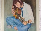 a painting of a woman playing a guitar on the wall
