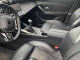 the interior of a car with black leather seats and a steering wheel