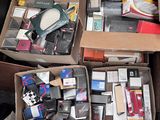 many boxes of electronic devices in a pile on the floor