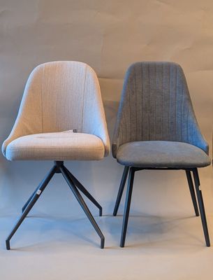 three chairs are sitting next to each other on a white surface