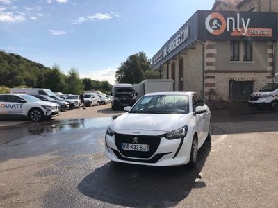 a white car that is parked in front of a building