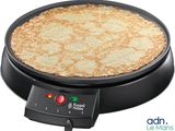 an image of a pizza being cooked on a grill