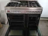 two ovens that are sitting side by side on the floor