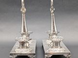 pair of silver plated candlesticks on stand