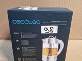 the box of a tea kettle is sitting on a cardboard box