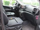 the interior of a car with the door open showing the driver ' s seats