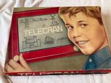 a box with a picture of a boy holding a television