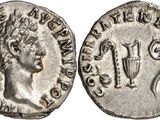 a silver coin with an image of a woman on it