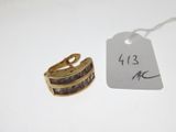 a ring and a tag on a white table