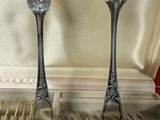 two forks and spoons in a case with silverware