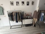 an image of a clothing rack in a clothing store