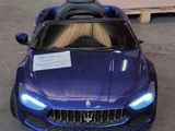 a blue toy car that is parked in a garage