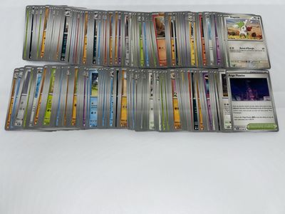 the cards are stacked up on a white surface