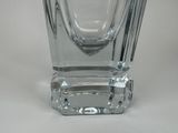 a glass vase that is sitting on a table