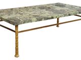 a marble top table with brass legs on a white background