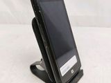 a cell phone that is sitting on top of a stand