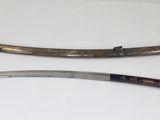 pair of antique chinese swords on display in museum case