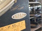 a close up of a scale on a shelf in a warehouse