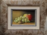 painting of a still life of grapes and an apple in a silver frame