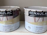 two buckets of paint sitting on top of a box