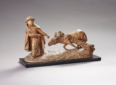statue représentant un homme avec un cheval tirant une charrette sur laquelle se trouve un autre homme
